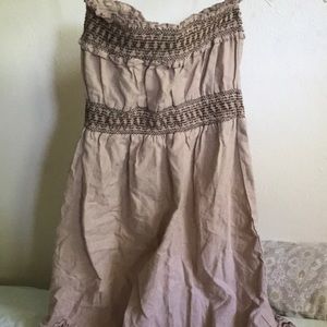 A cute vintage tan strapless dress